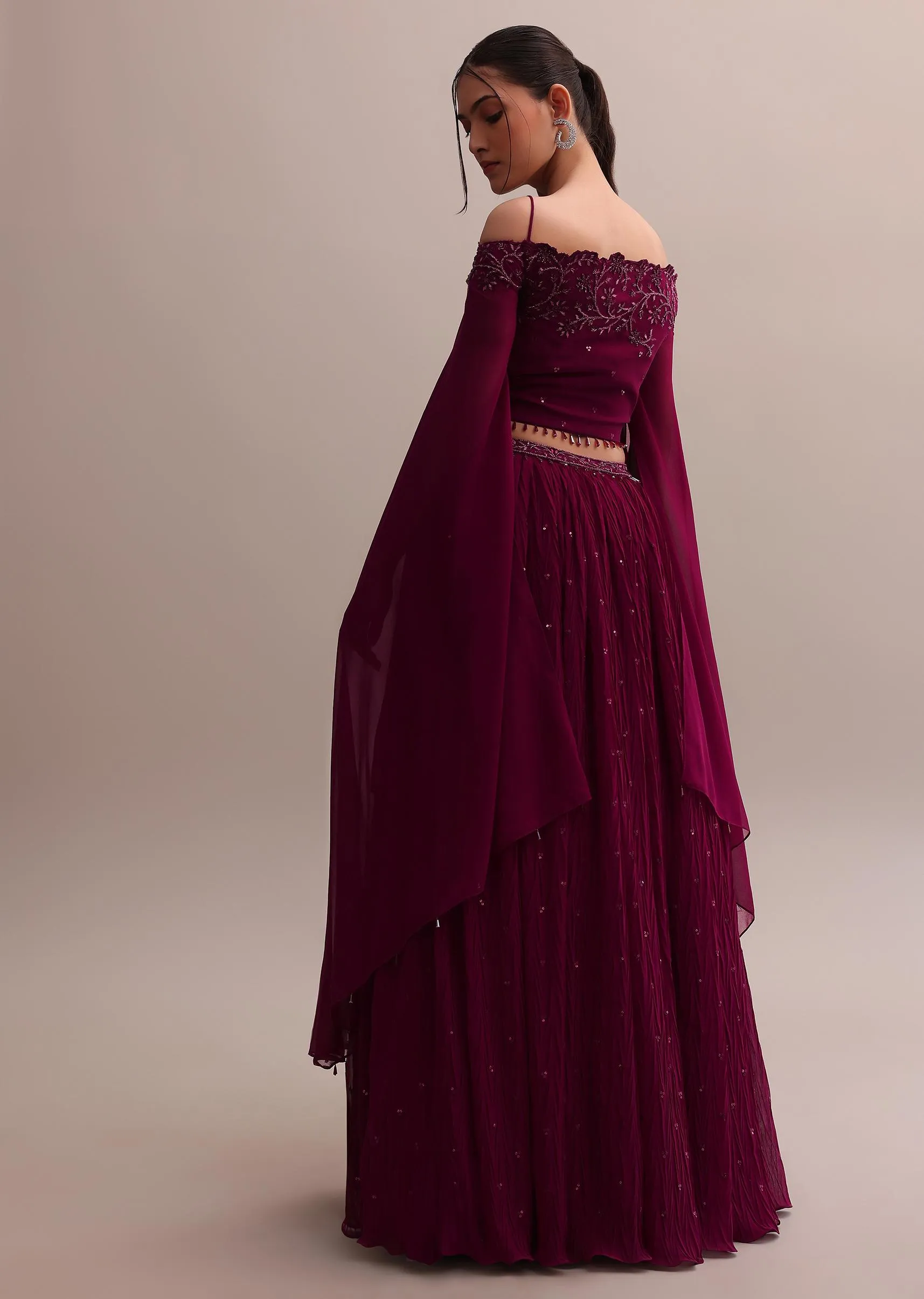 Lavish Wine Georgette Lehenga And Off-Shoulder Crop Top With Attached Cape